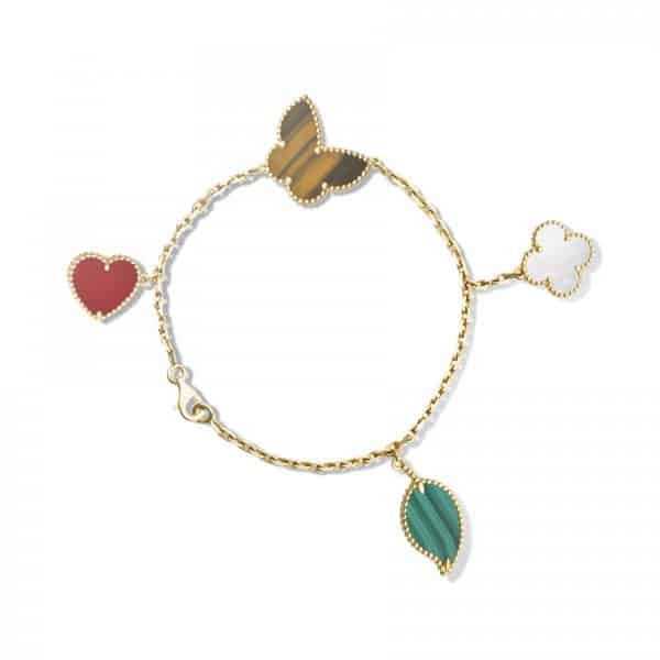 أساور ذهبية بأحجار ملونة لإطلالة فخمة هذا الصيف