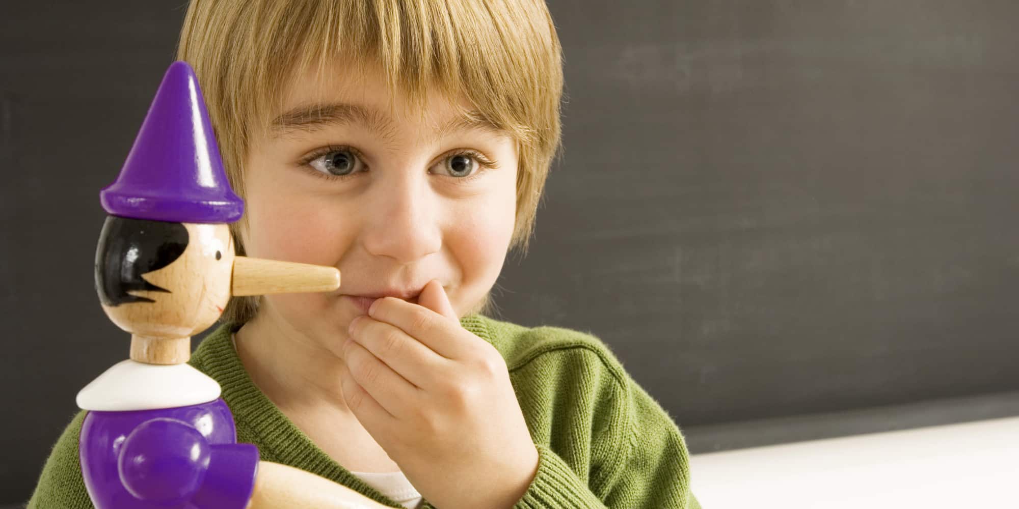 Close-up of a boy with a toy
